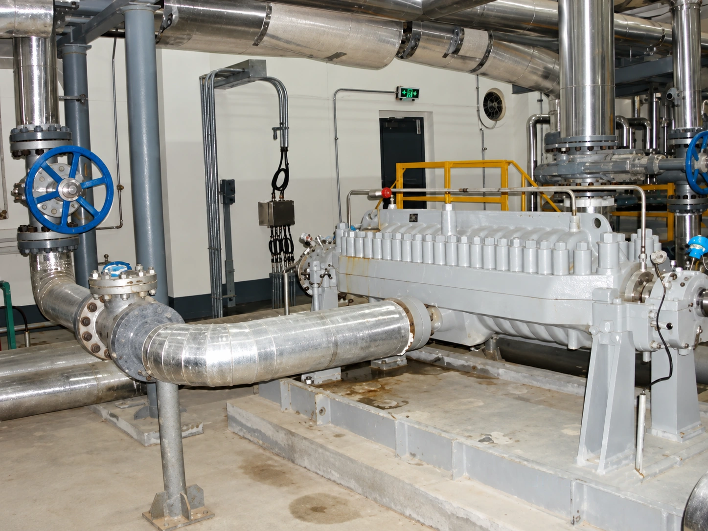 White horizontal pump installed with a large inlet pipe.