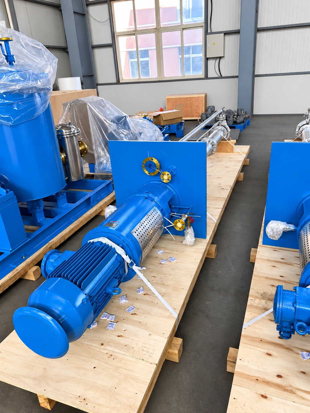 Blue pump assembly and motor in the workshop.