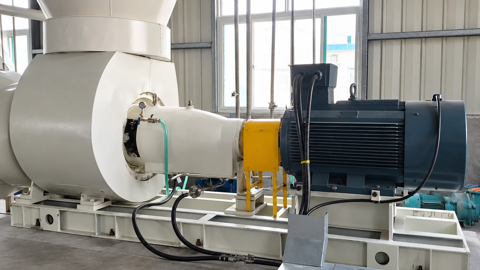 Side view of a chemical axial flow pump with an electric motor and yellow coupling guard.